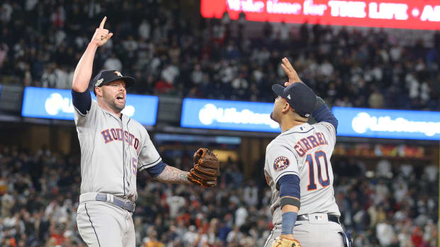 Ryan Pressly and Yuli Gurriel celebrate